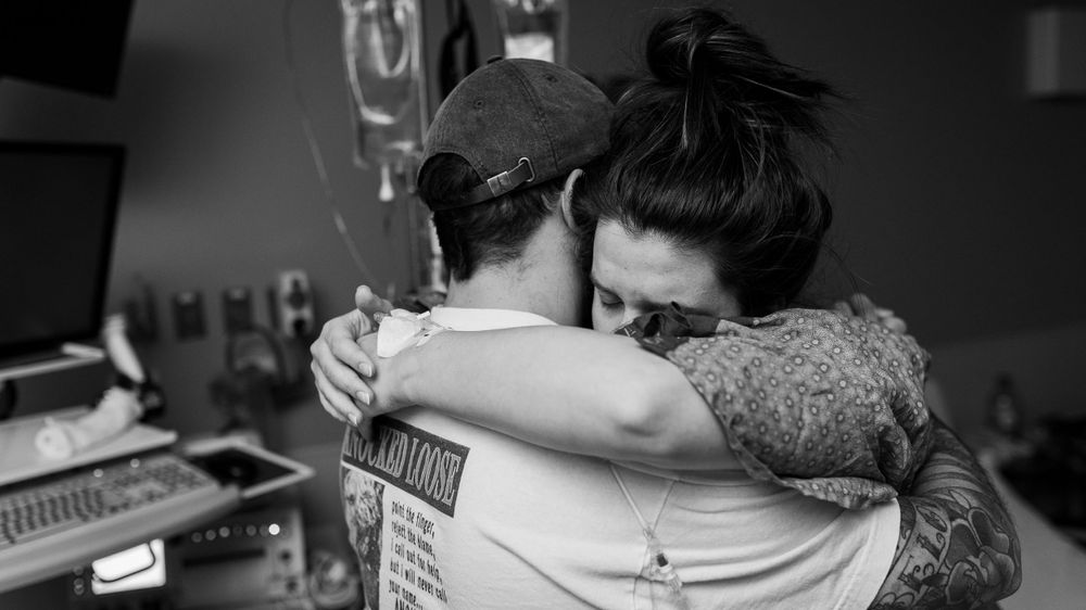 Husband supports his wife through a contraction during their Longmont Colorado birth