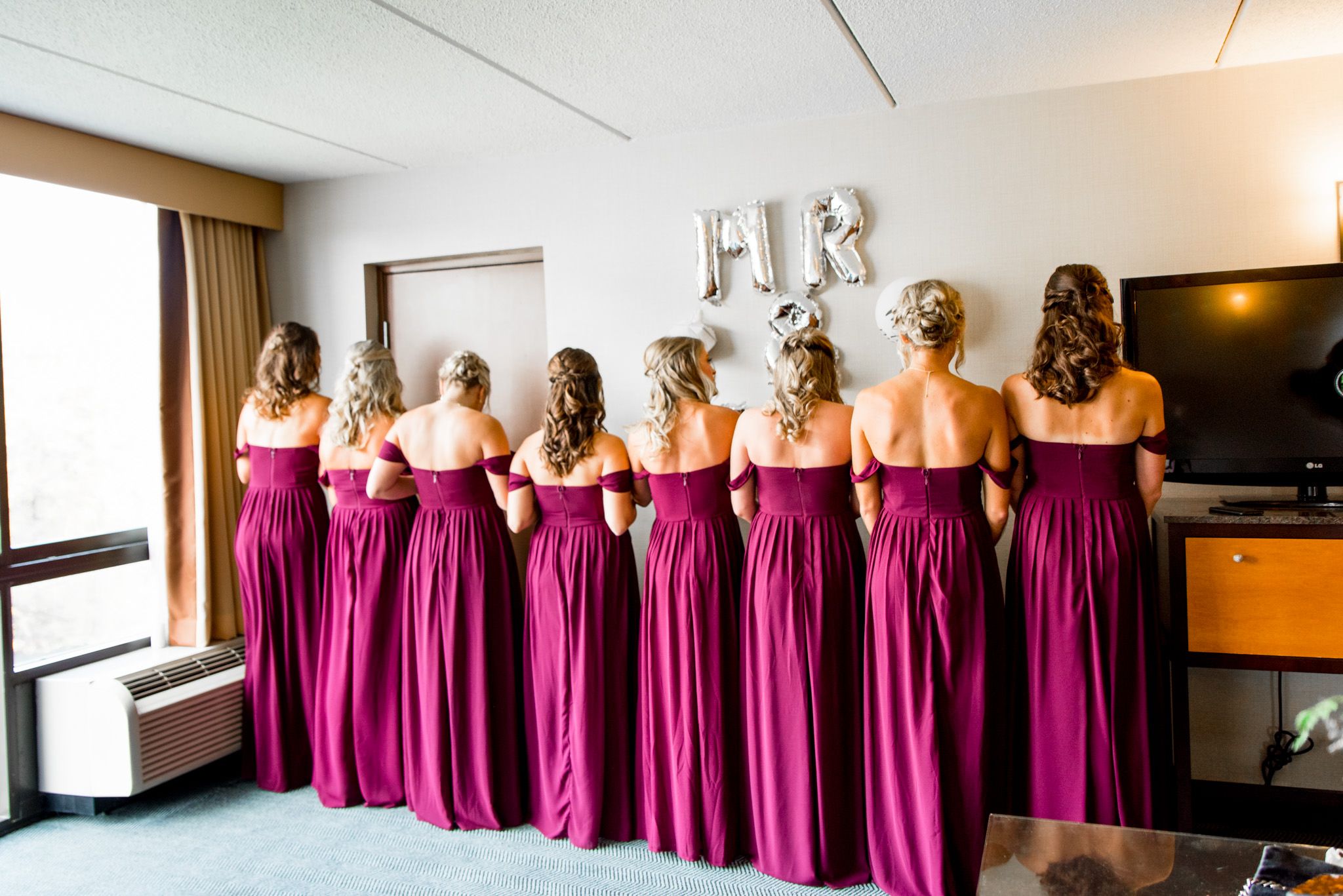 chicago bridesmaids show their styled hair before fall wedding ceremony