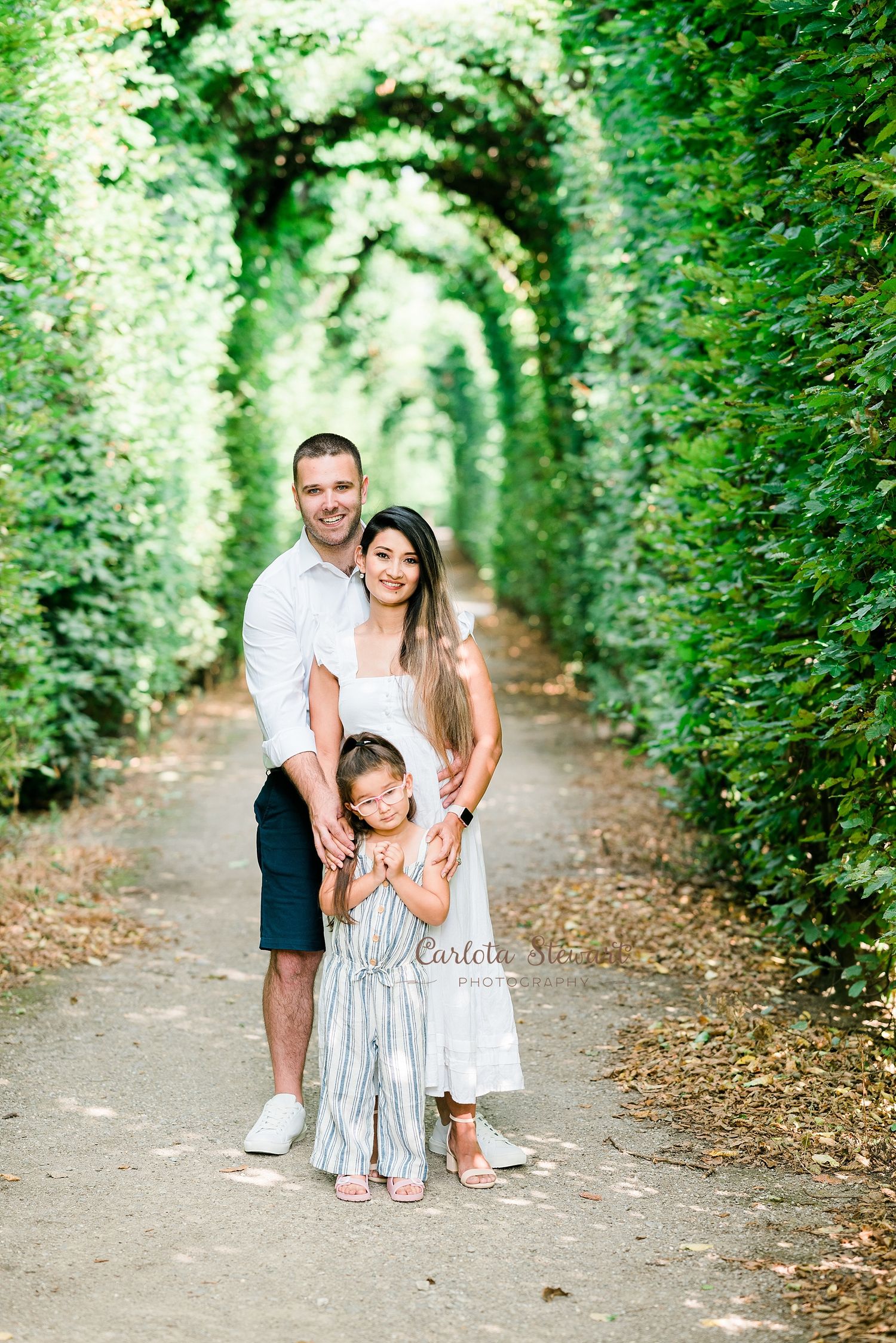 Family posing for a destination photoshoot in a park in Vienna Austria