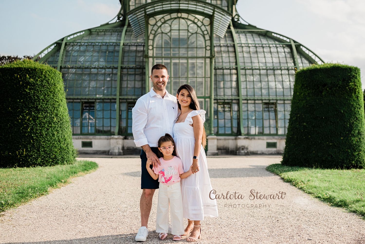 Family posing for a destination photoshoot in a park in Vienna Austria
