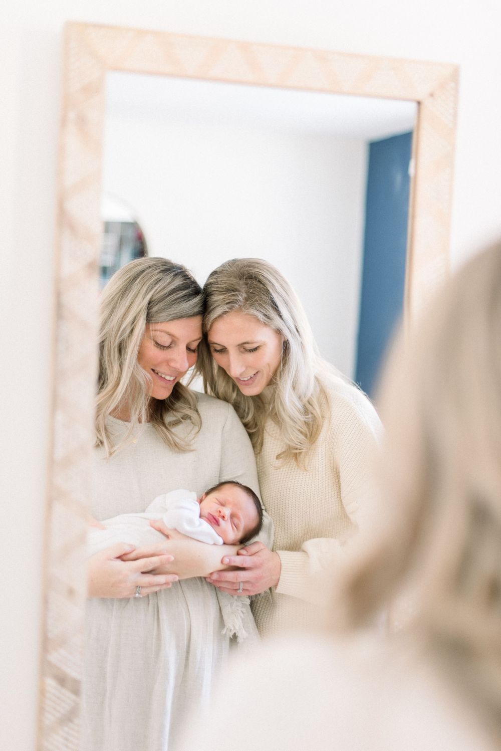 two moms with newborn baby captured by dc newborn photographer