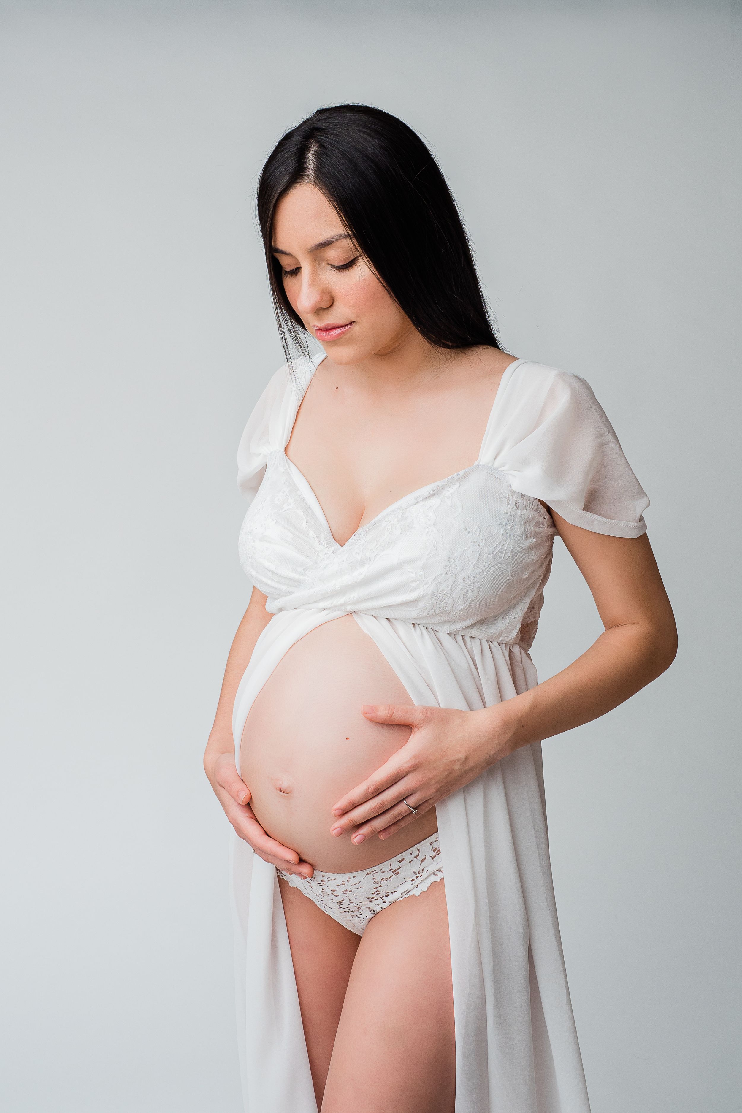 Pregnant woman wearing a white dress in Mödling