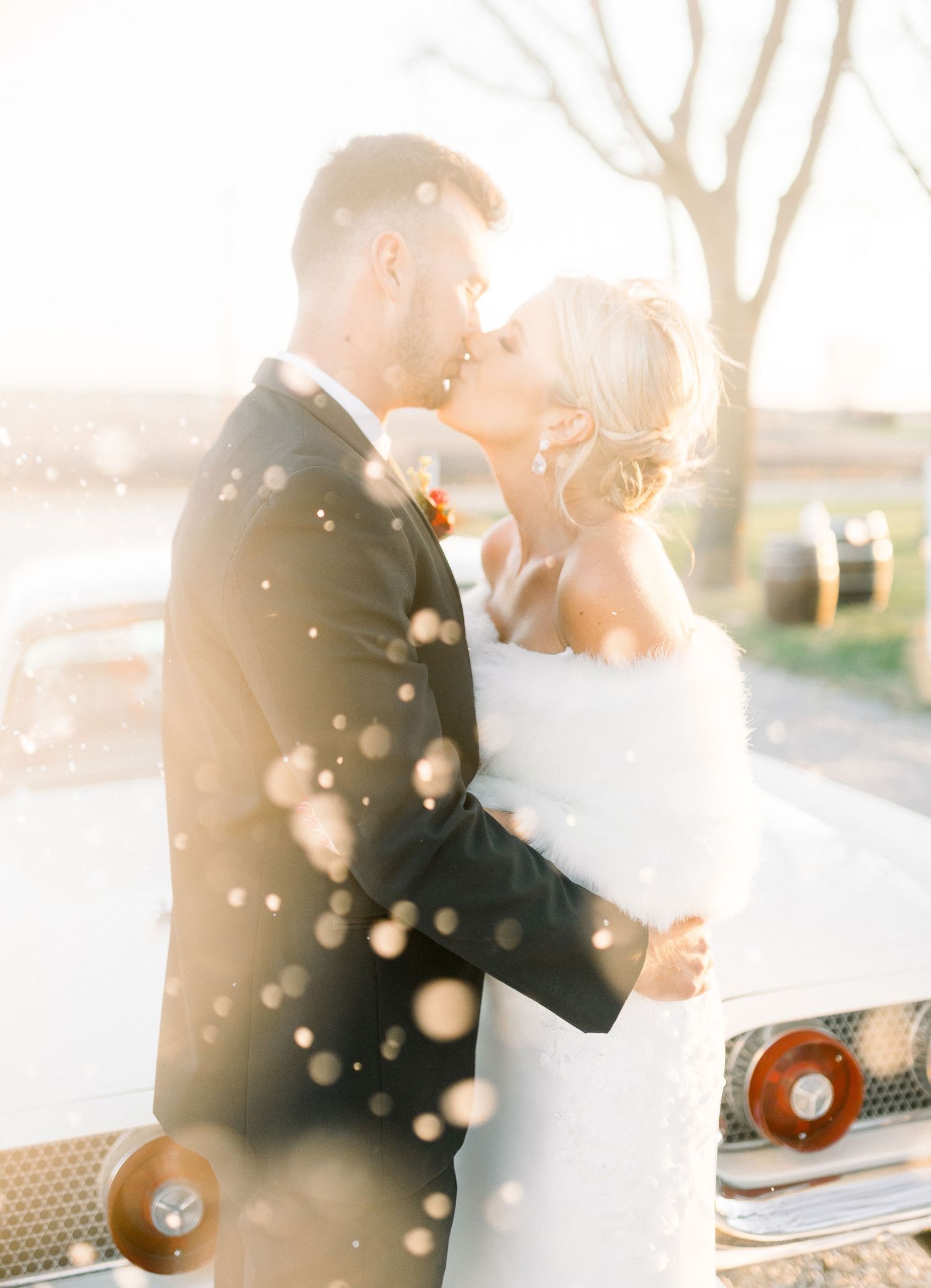 Light and airy Elopement wedding with vintage car at 1868 Farmhouse Wedding in Boone, Iowa with Modern Dress bridal gown