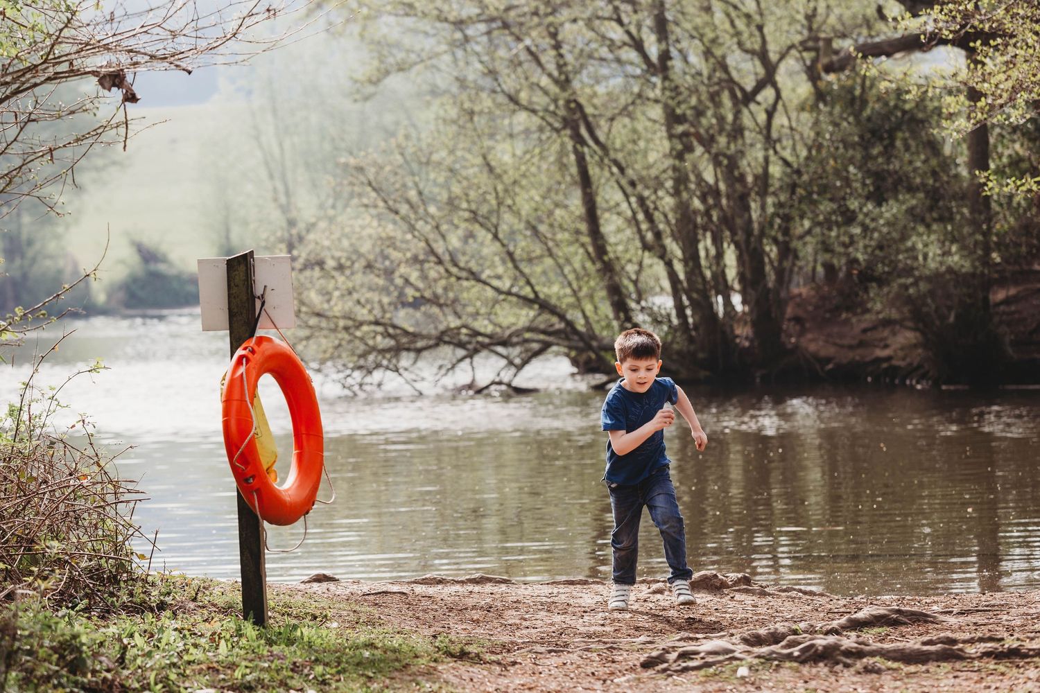 boy running away from lake South Weald