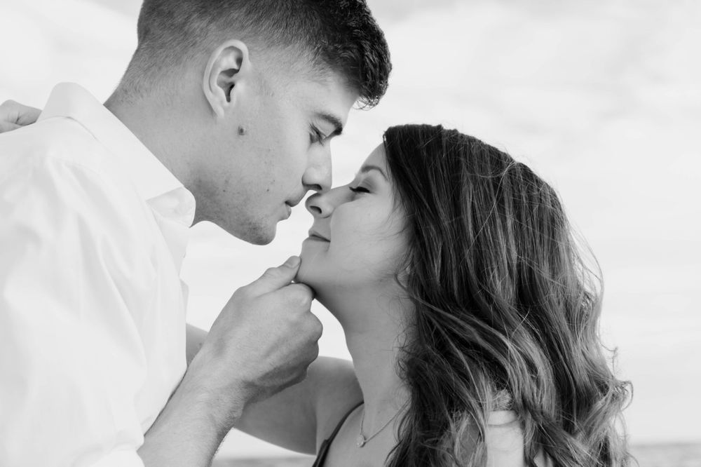 man about to kiss a woman on a beach in Fort Walton Beach, Florida