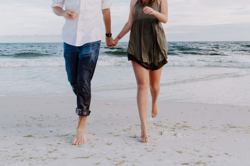 couple running on the beach in Florida