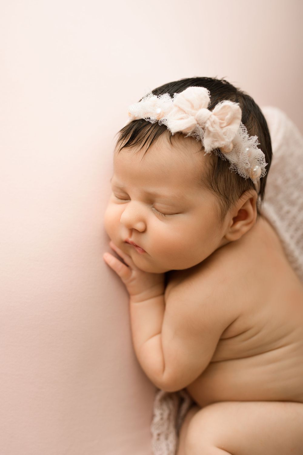 newborn baby pose in studio