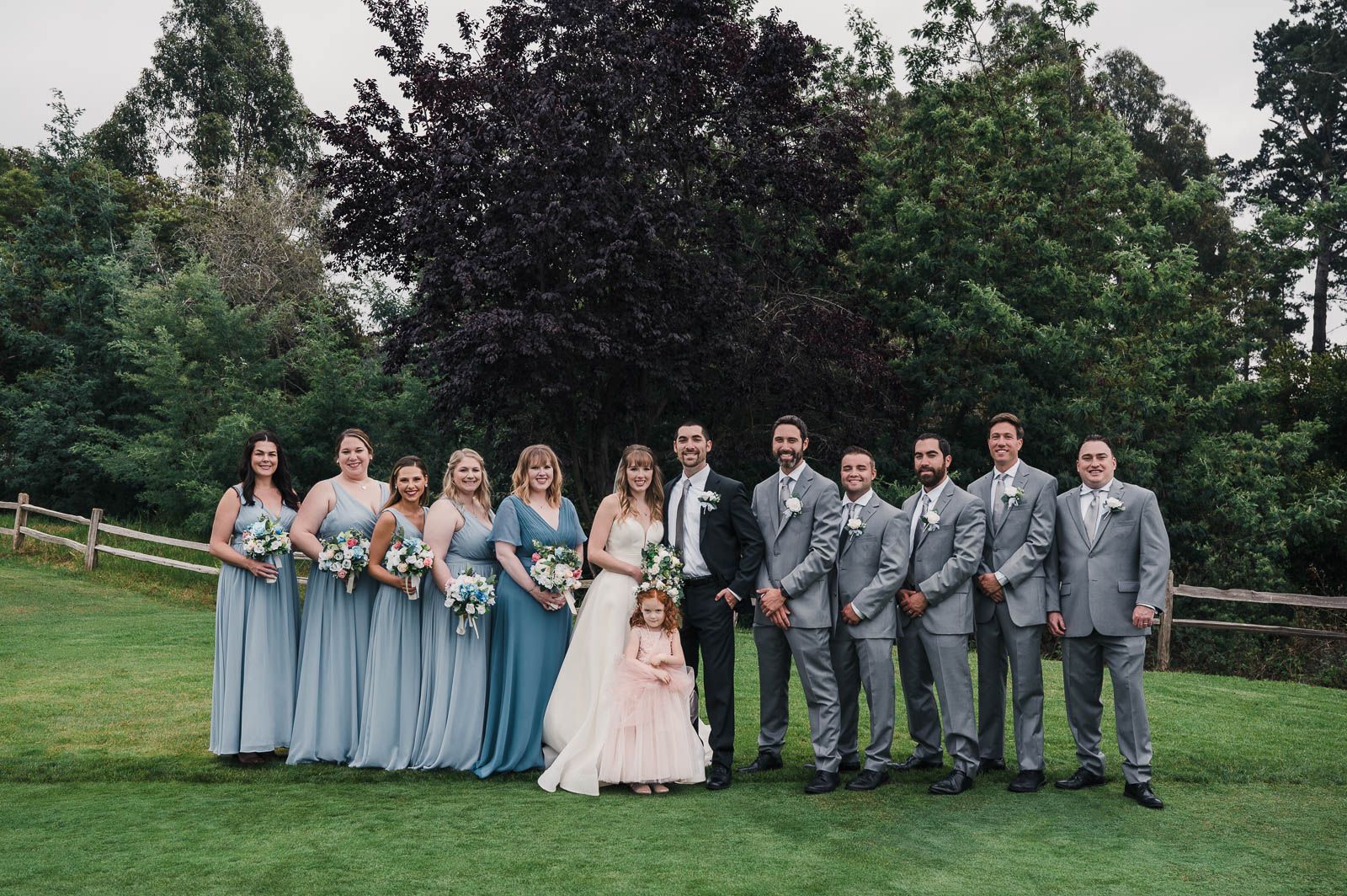 Portrait of bride and groom with their whole bridal party. Bridesmaids, Groomsmen, and flower girl