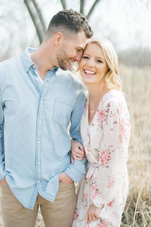 Light and airy film lakeside dock engagement session at Gray's Lake in Des Moines, Iowa