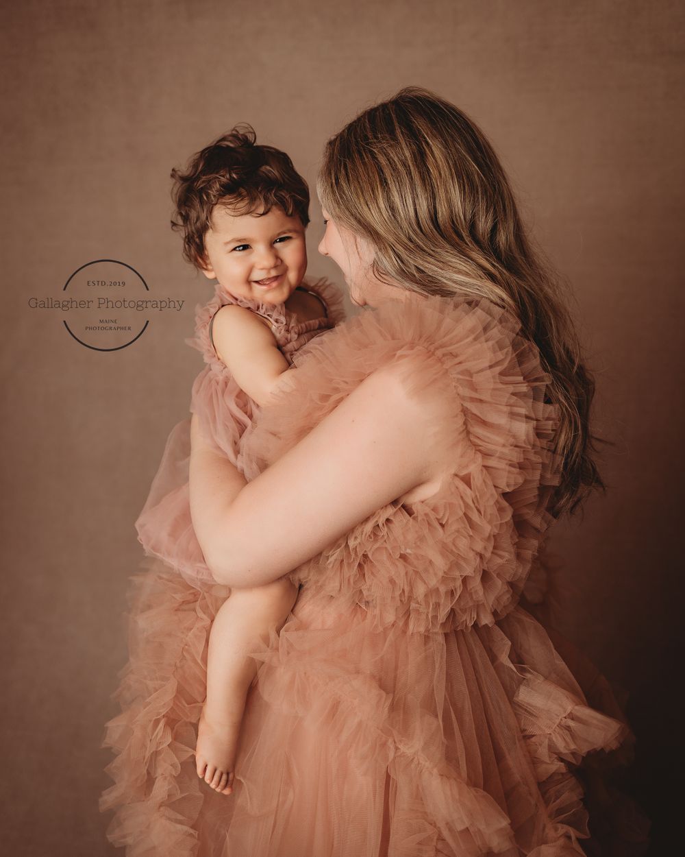 Intimate moment between mother and daughter during studio session