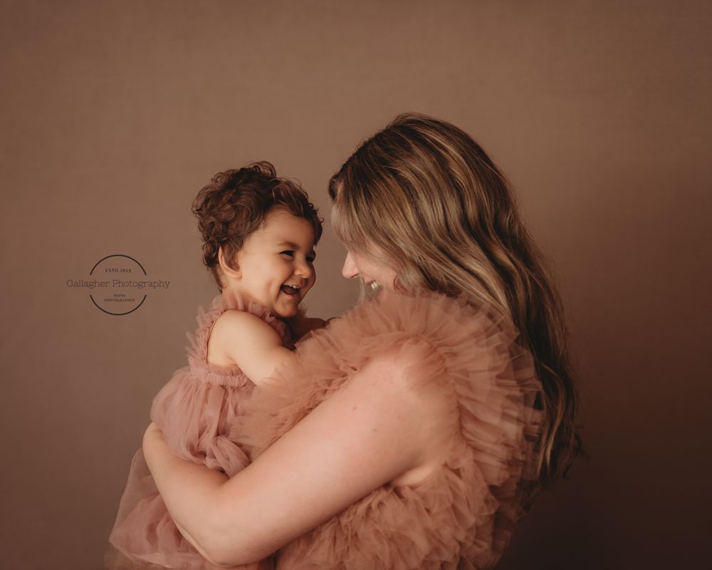 Intimate moment between mother and daughter during studio session