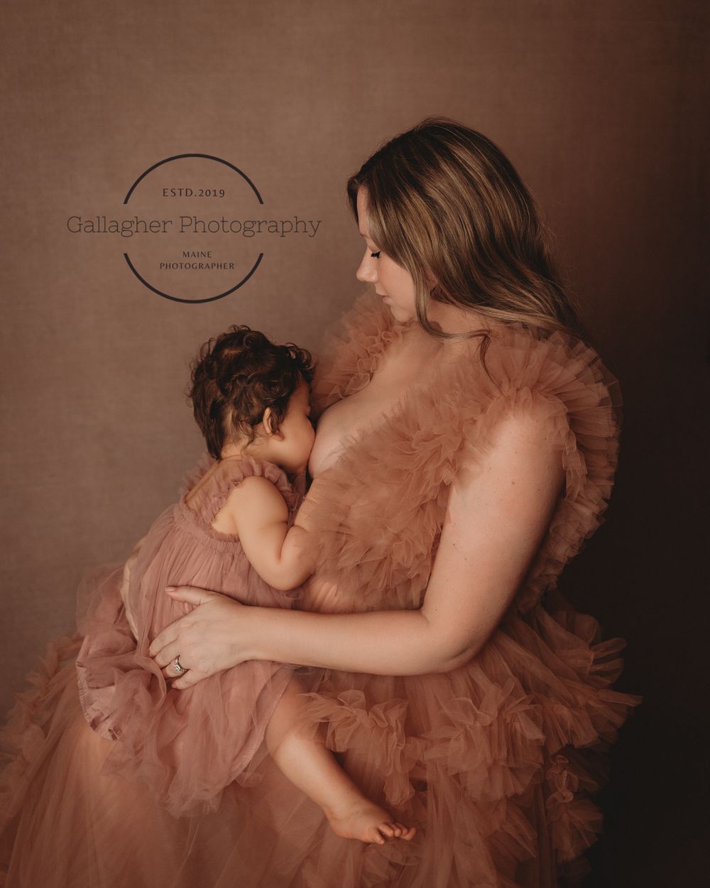 Intimate moment between mother and daughter during studio session