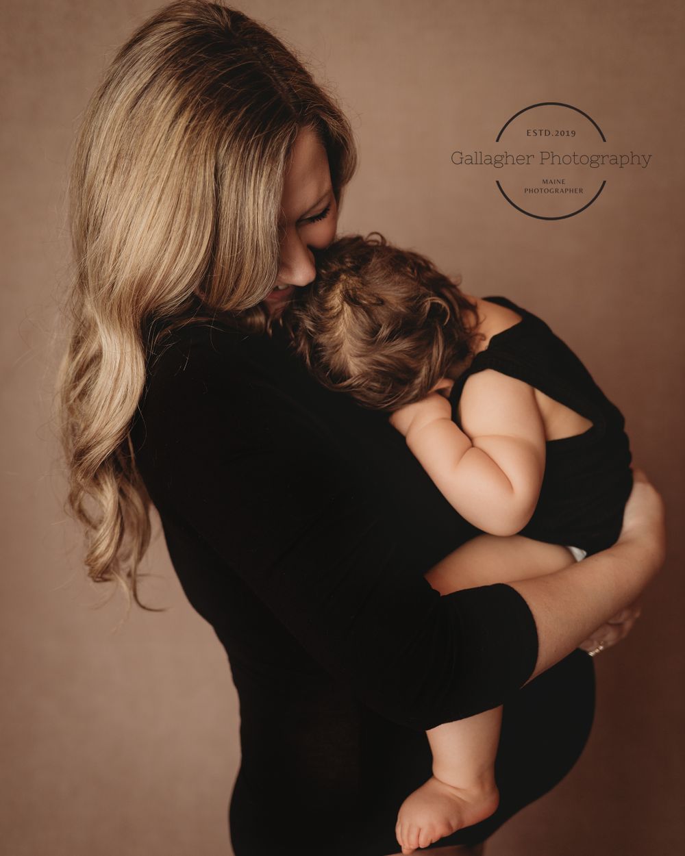 Intimate moment between mother and daughter during studio session