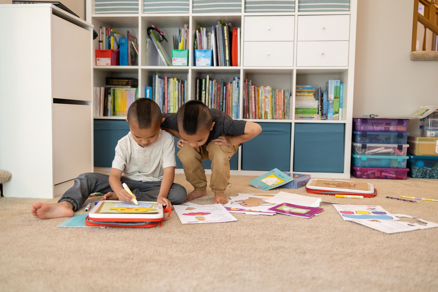 2 kids on floor one looking over shoulder at others work Homeschooling entrepreneur mom Maple Valley, WA branding photo