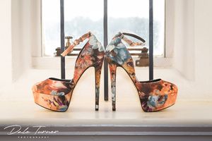 Very high heeled designer wedding shoes.