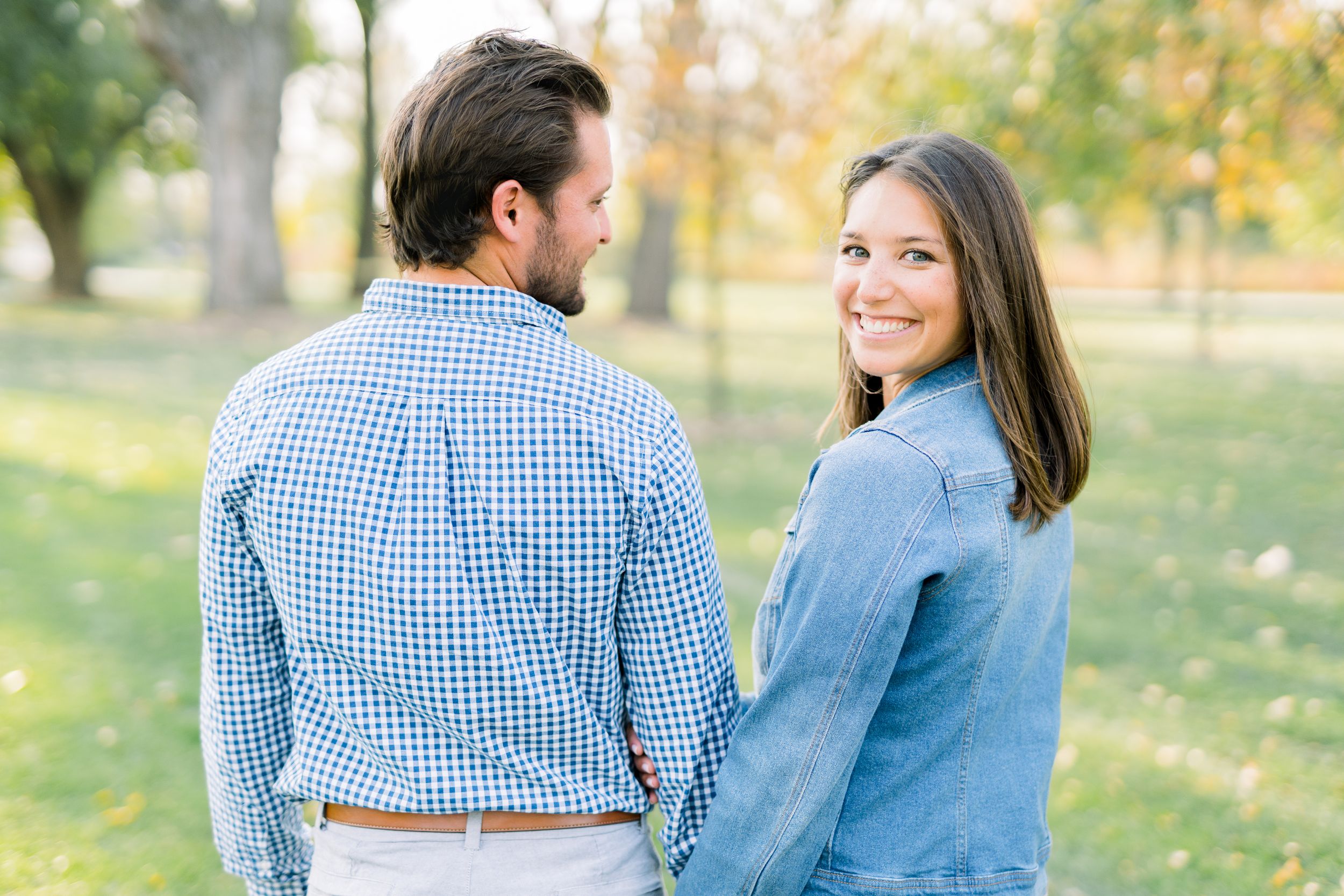 Des Moines Engagement photos at Grays Lake in downtown Des Moines, Iowa with light and airy photographer Nicole Laing