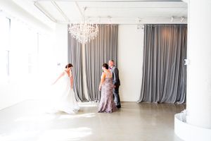 bride at Room 1520 wedding in Chicago sees her parents for the first look on wedding day