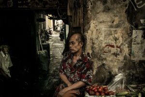 Man selling fruit in the Gloodok district of Jakarta Indonesia
