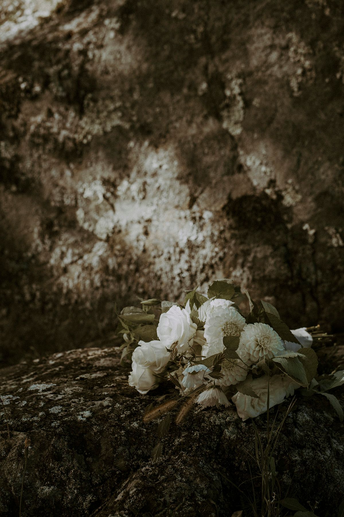 Fresh wild flowers bouquet on a rock at Domaine Jolivent during an intimate wedding in eastern townships