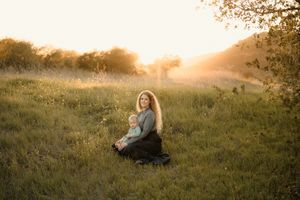Motherhood photoshoot by Tiffany Kelterer, photographer in San Diego of mom holding baby in Mission Trails San Diego