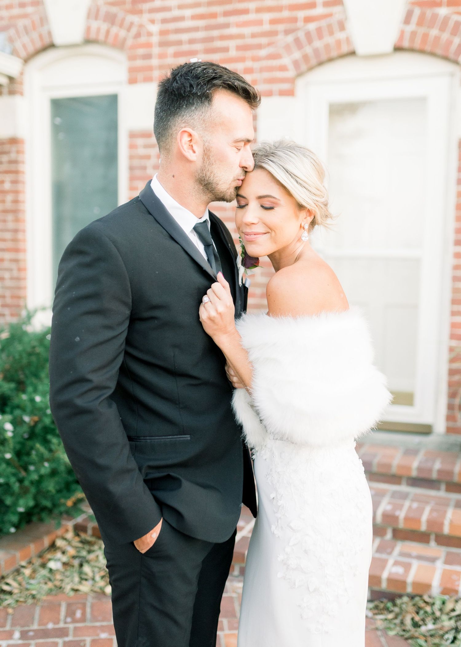 winter wedding at 1868 Farmhouse Wedding in Boone, Iowa with Modern Dress bridal gown