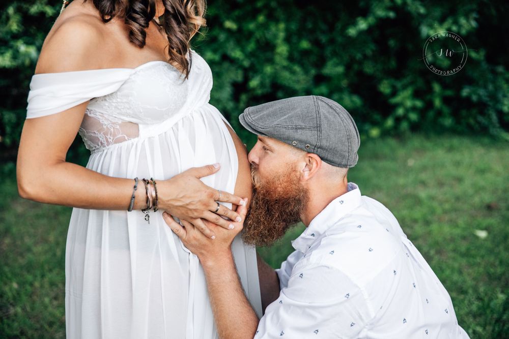 Daddy kisses Mama's belly