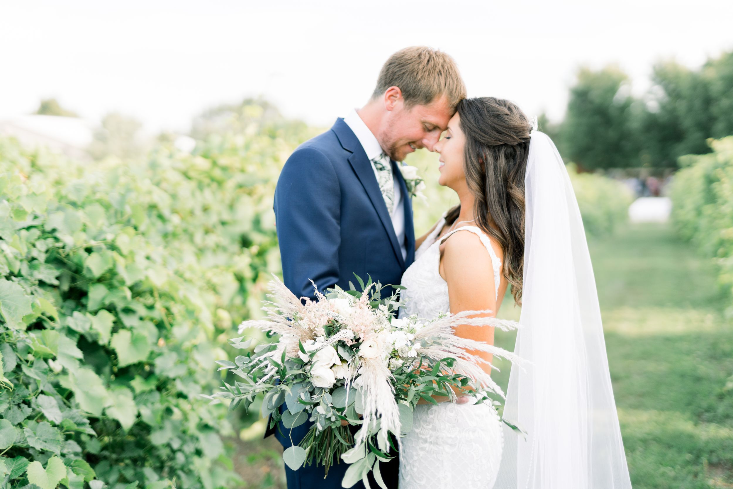 Vineyard photos with white willow events at Prairie Moon Winery wedding in Ames, Iowa