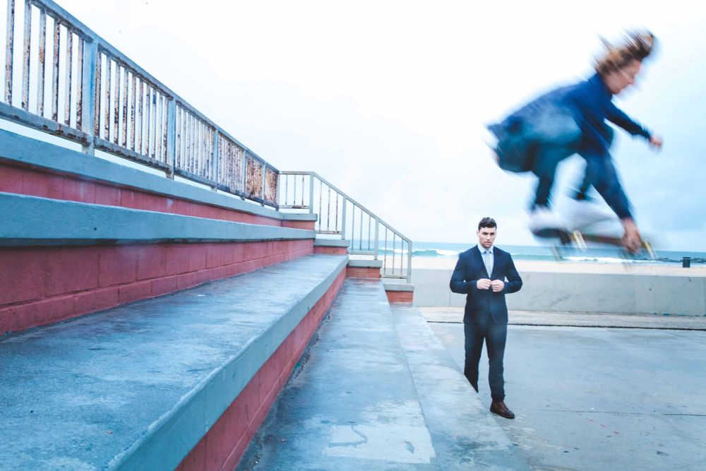 Actor Christian James Smoking in Suit Men's Fashion Trends Handball Court Venice Beach Interview Magazine