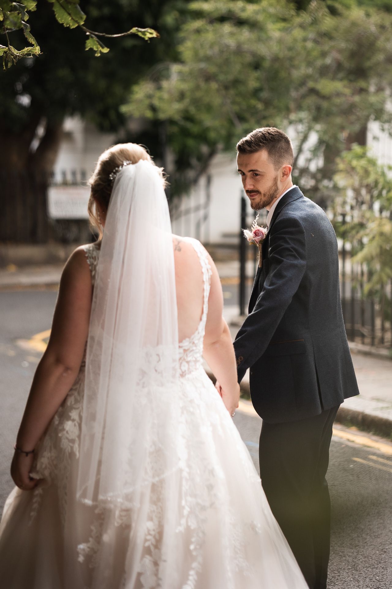 Groom looking lovingly at his bride in Chelsea London