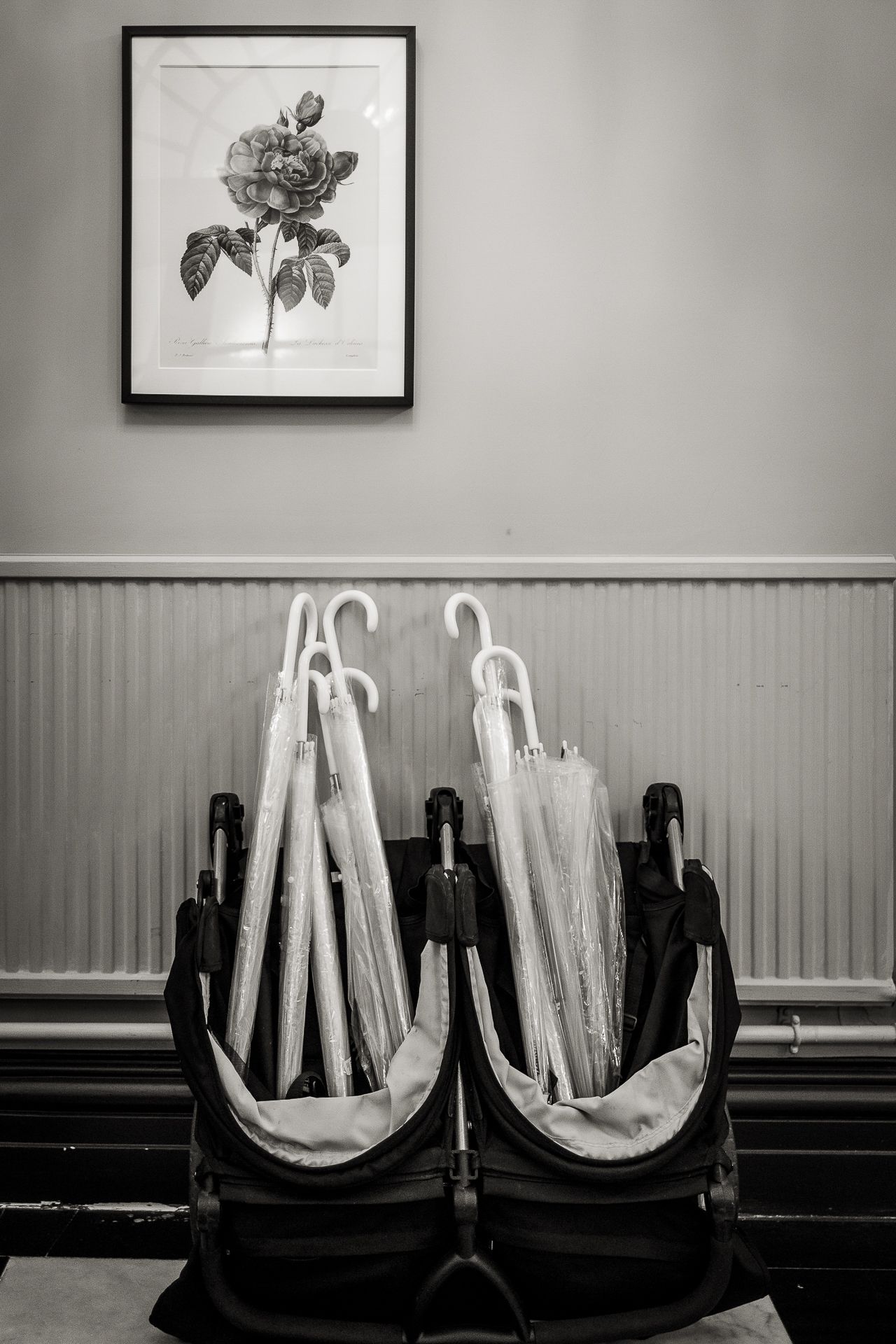 Clear wedding umbrellas inside waiting area of London registry office of London Borough of Kensington and Chelsea.