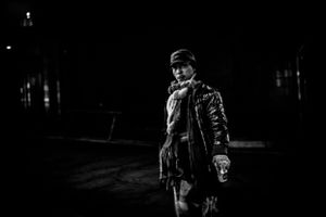 Black and white photo men walking with coffee at night in street of Soul South Korea