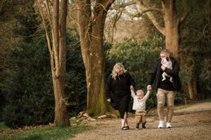Family of four walking along path at Nobelius Heritage Park in Emerald