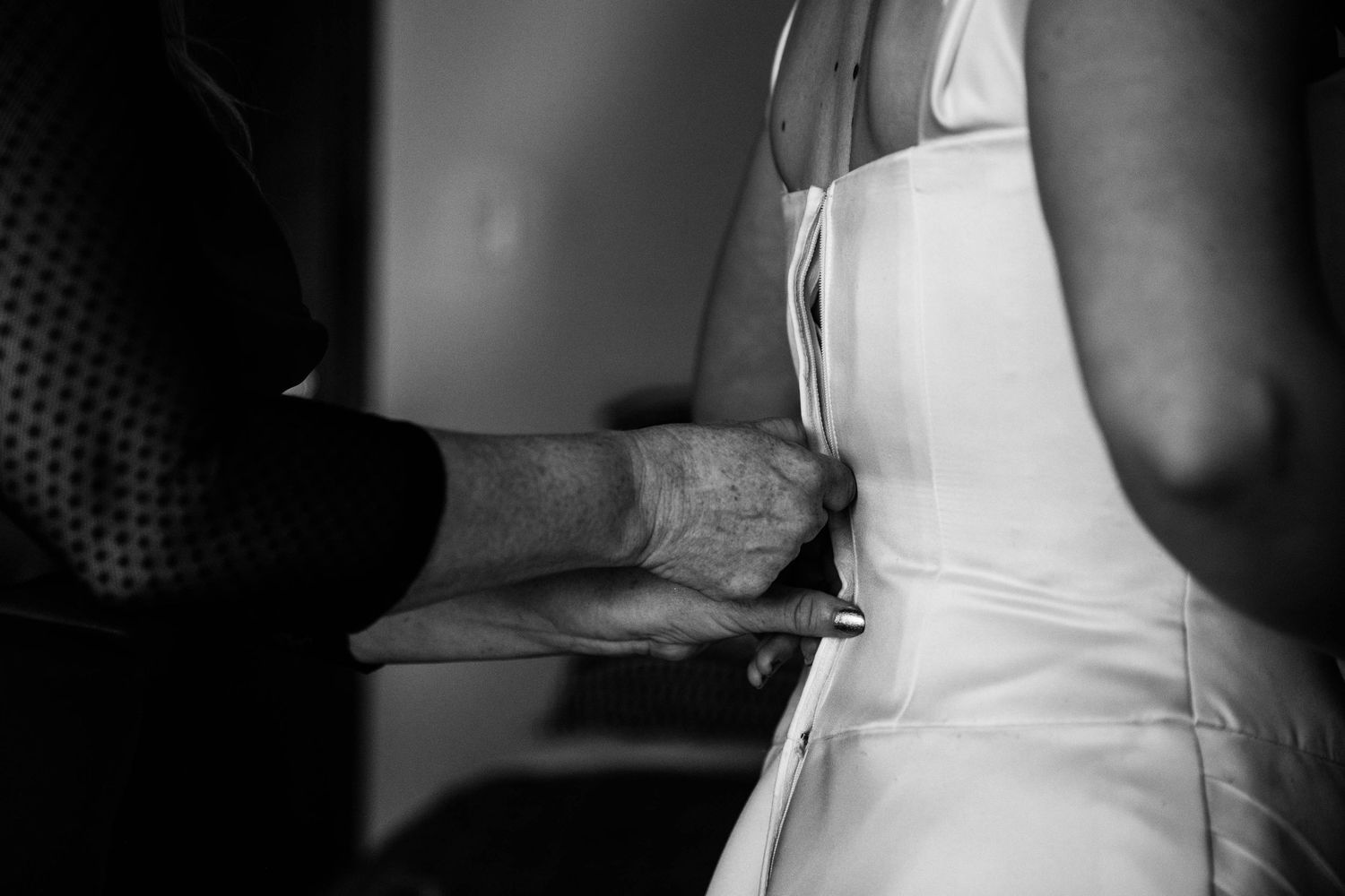 Zipping up Wedding Dress
