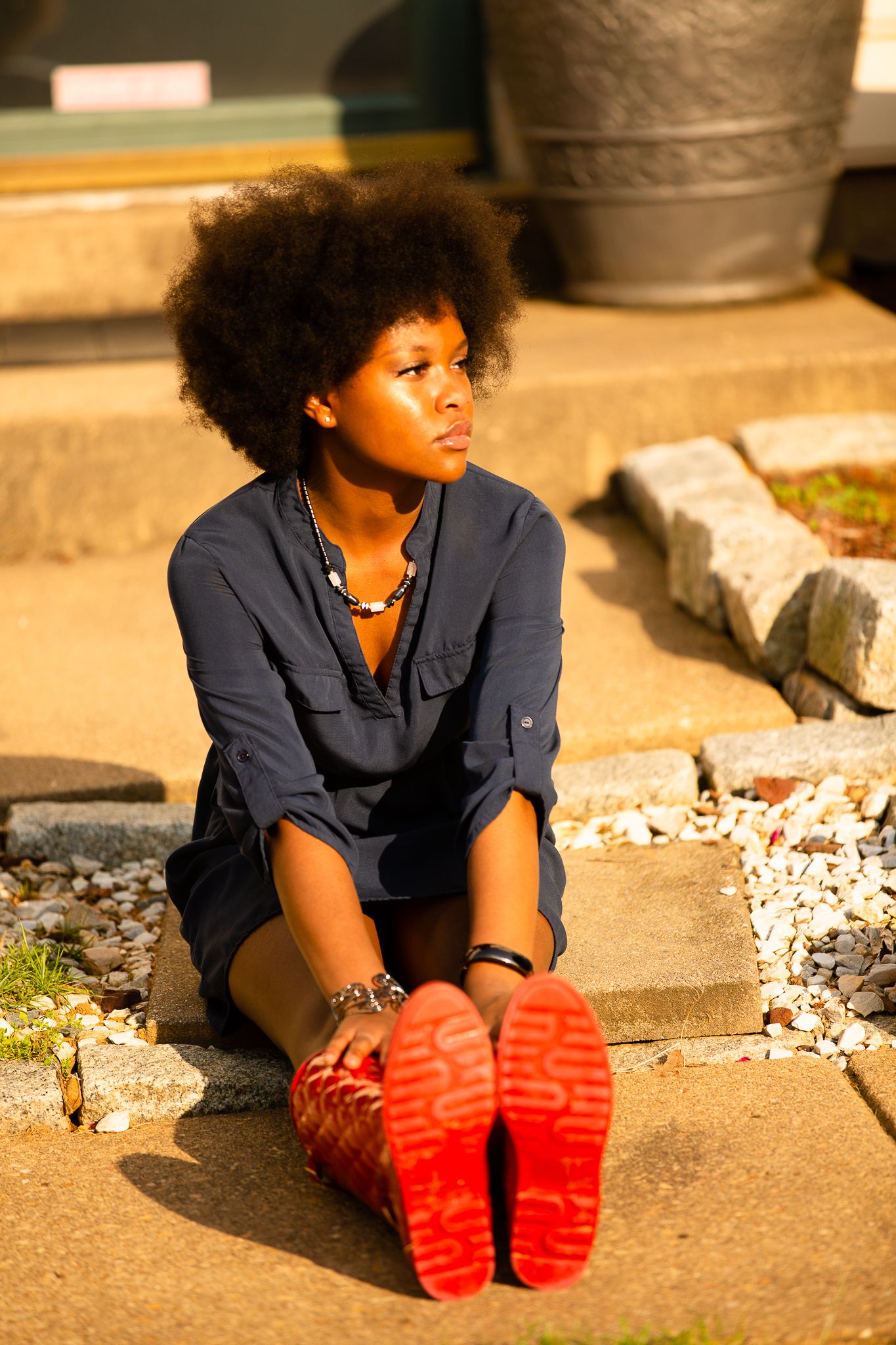 model with red boots and bronze face