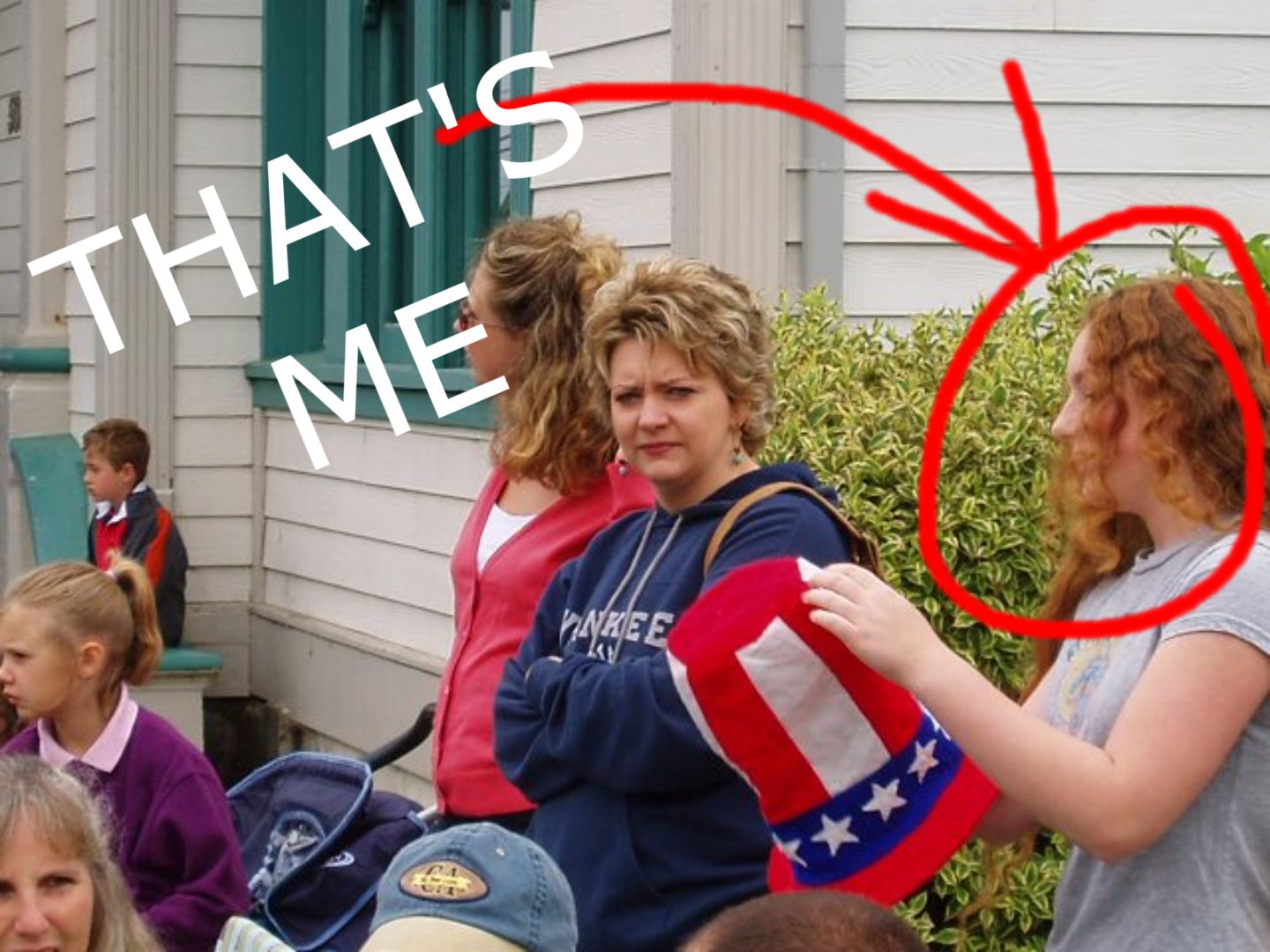 ME WHEN I WAS ABOUT 14 Y.O. A SUPER DORKY, FIZZY HAIRDED, REDHEADED TOMBOY HOLDING AN AMERICAN FLAG UNCLE TOM HAT