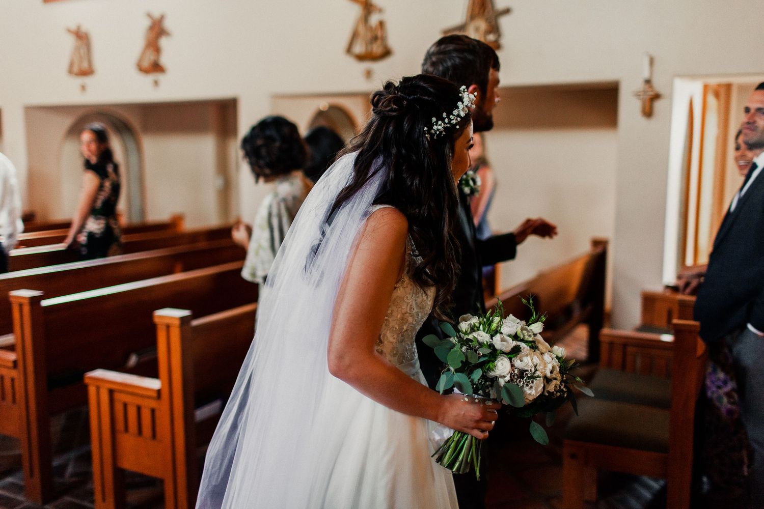 chelly & luke walking down the aisle after marriage