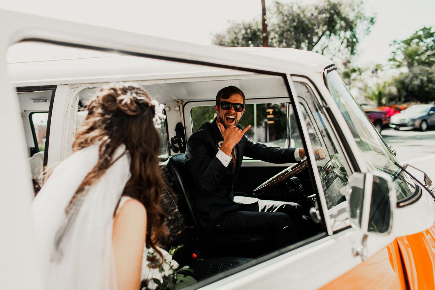 luke driving volkswagon getting ready for wedding party pictures
