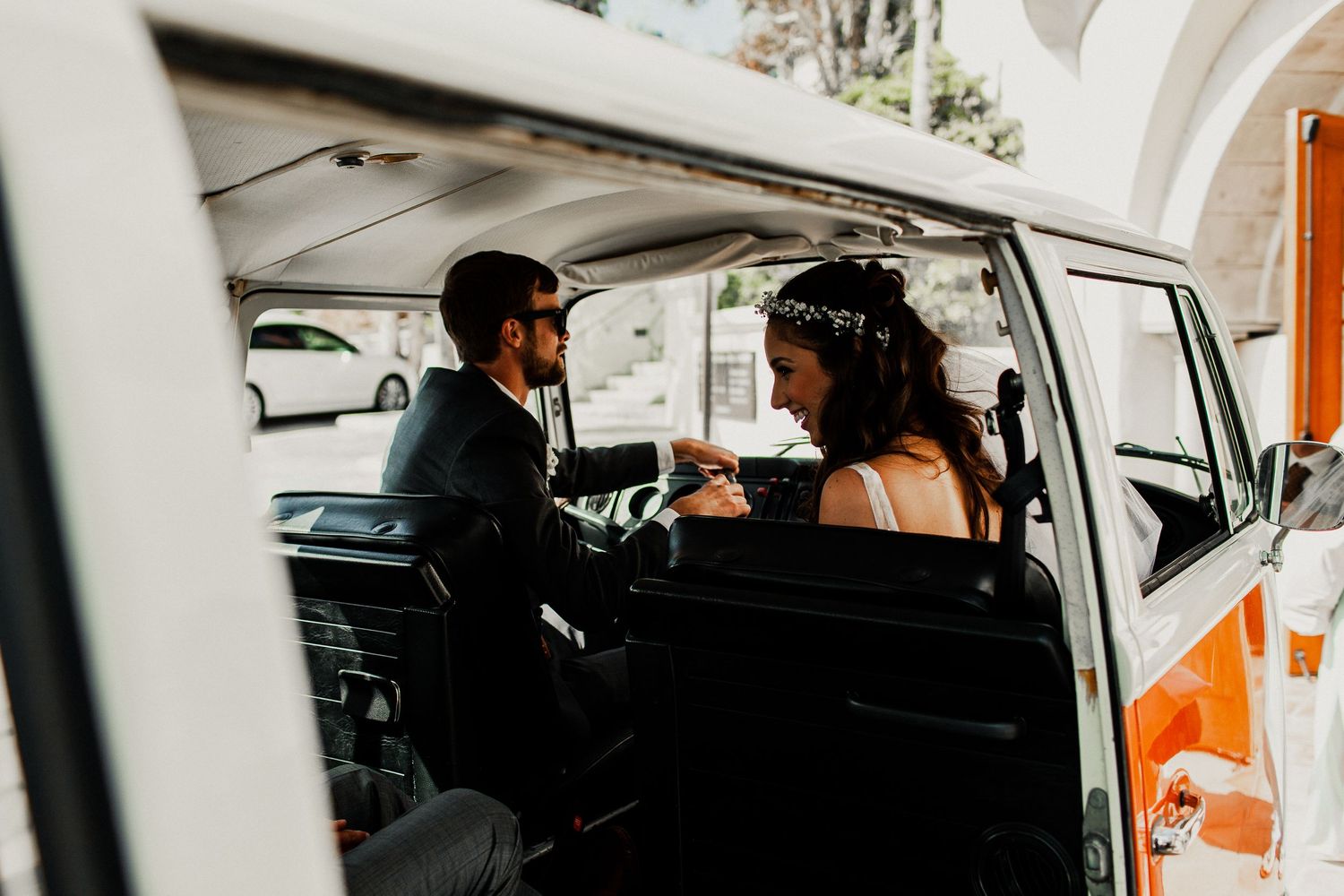 bride and groom inside volkswagon van