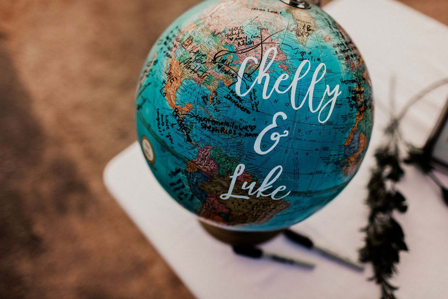 chelly and luke globe sign in at reception decor