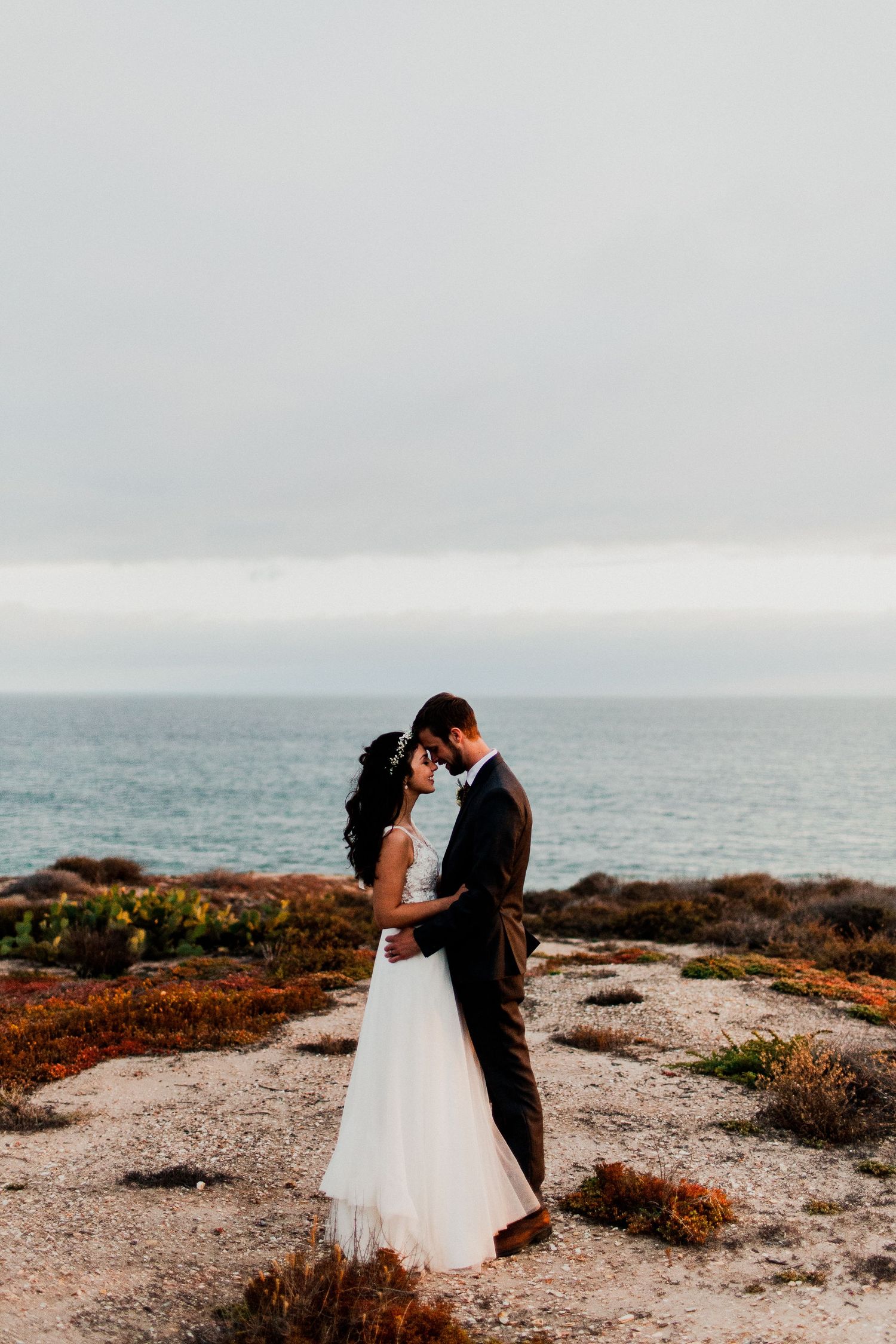 bride and groom during golden hour at crystal cove