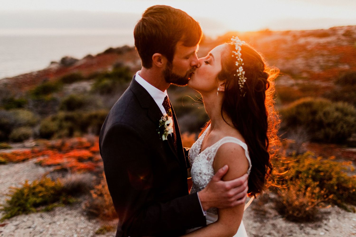 bride and groom kissing during portrait session