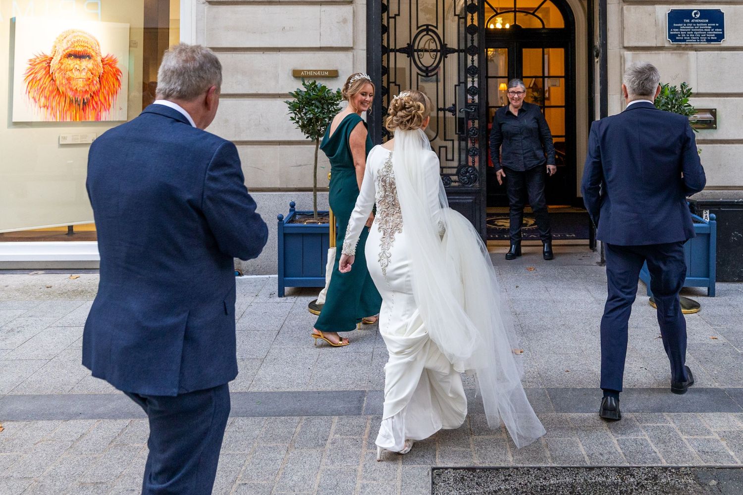 wedding party greeted at the door to the Athenaeum liverpool city centre wedding Stuart Morris Photography