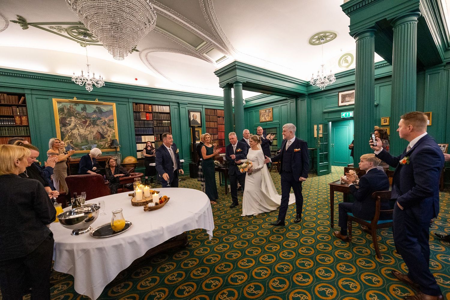 bride and groom in the library at the Athenaeum. Stuart Morris Photography Liverpool wedding photographer