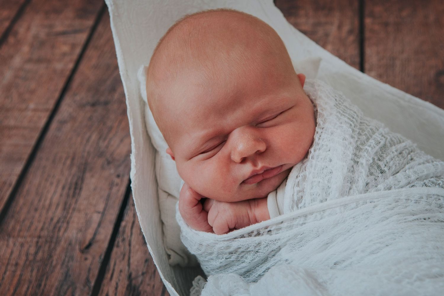 Newborn baby in bump cast by Devon photographer Melanie Barnfield Photography