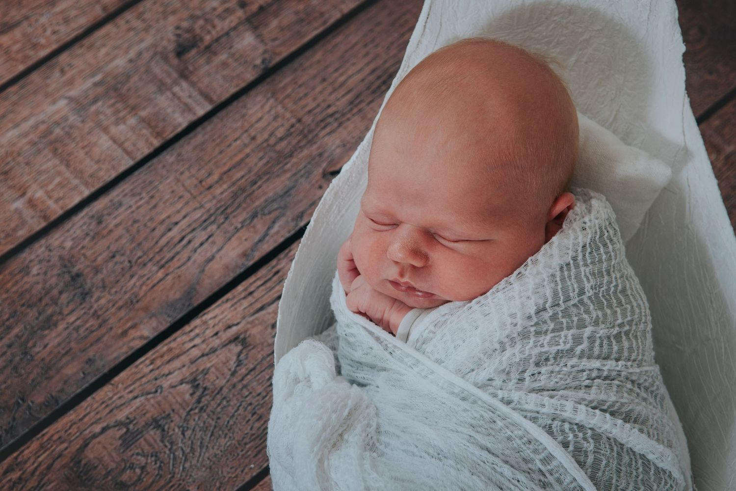 Newborn baby in bump cast by Devon photographer Melanie Barnfield Photography
