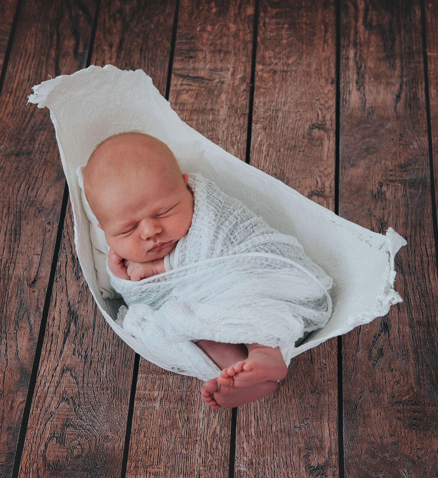 Newborn baby in bump cast by Devon photographer Melanie Barnfield Photography