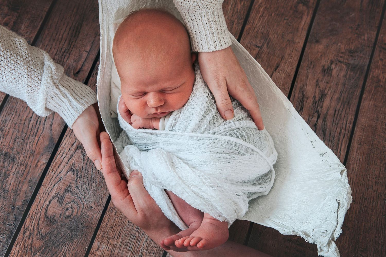 Newborn baby in bump cast by Devon photographer Melanie Barnfield