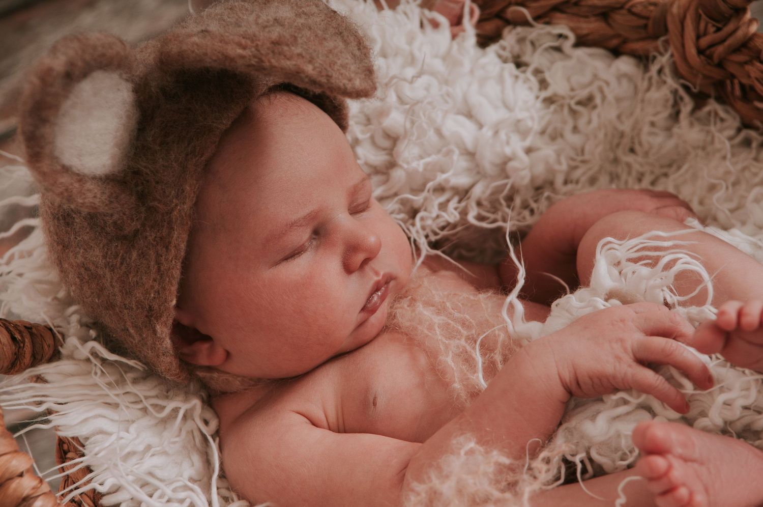 Newborn baby in easter bunny hat by devon newborn photographer Melanie Barnfield