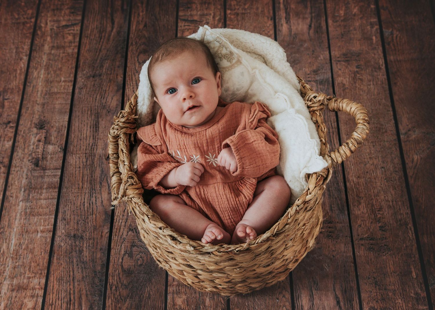 Boho baby in basket by Melanie Barnfield Photography