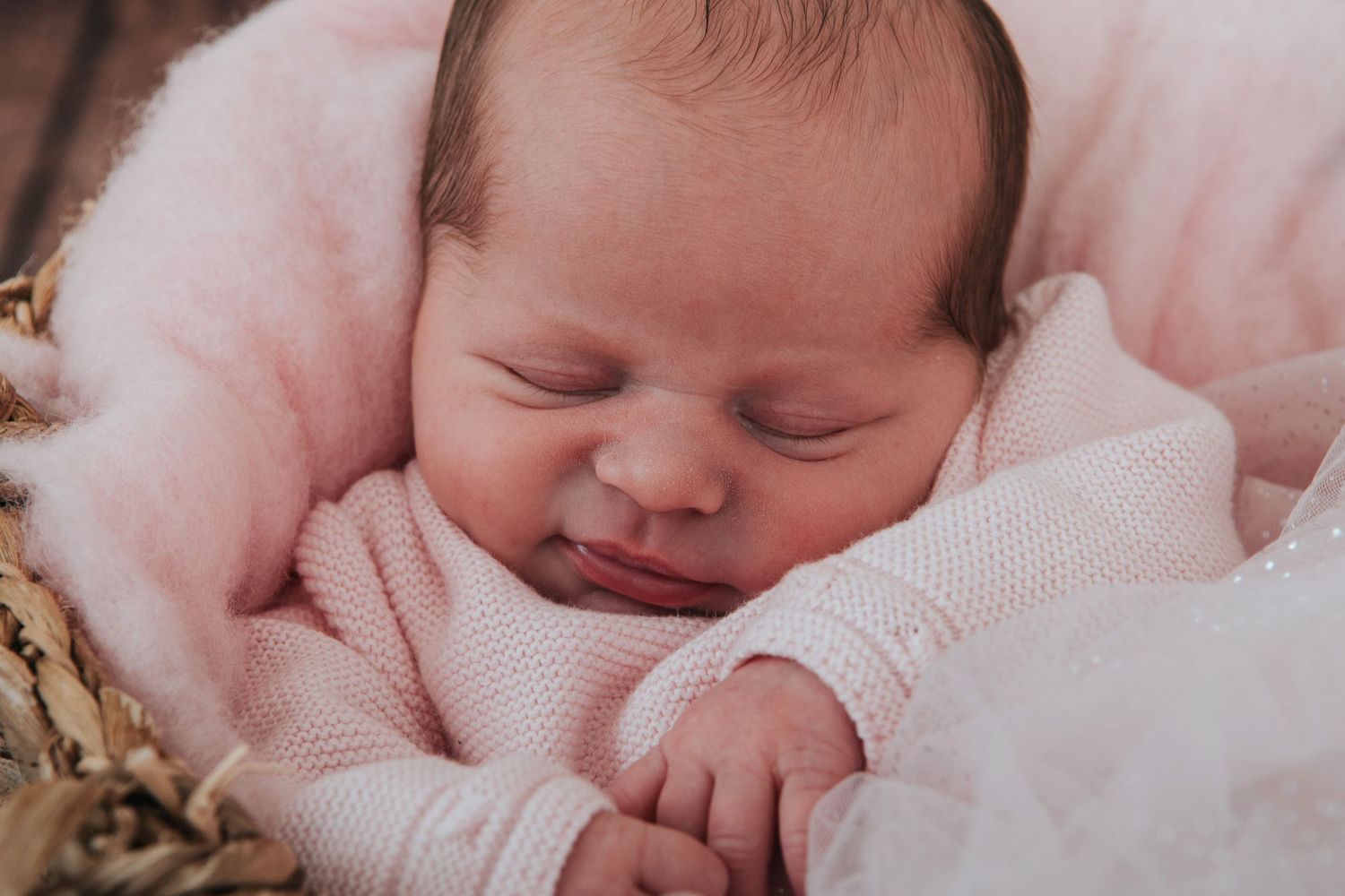 Newborn baby smiles by devon based photographer Melanie Barnfield